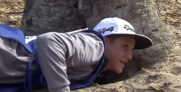 WATCH: Kid Caddie Risks Arm For PGA Pro Dad